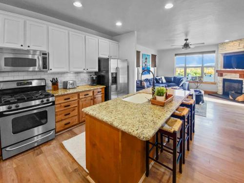 a kitchen with a kitchen island with a counter top at 5410 Cross Country Mountain Ski Getaway with Hot Tub Pool! by SkyRun Park City in Park City