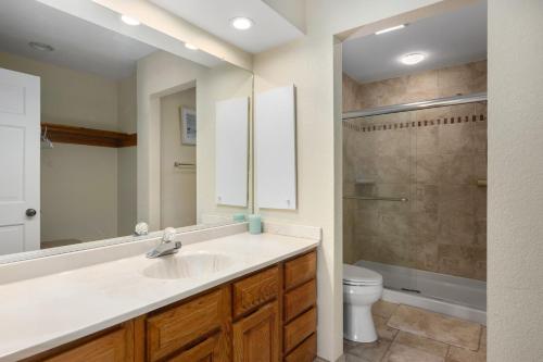a bathroom with a sink and a toilet at QA4 Coastal Comfort in Nags Head