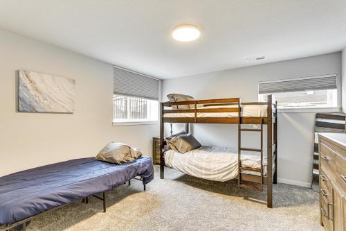 a bedroom with two bunk beds in a room at Spacious and Modern Home with Deck in Oregon! in Oregon