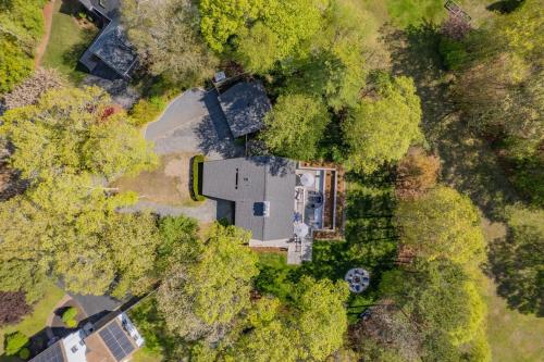 an overhead view of a house in the trees at 10 Bunker Circle Sandwich - The Clubhouse Retreat in Sandwich