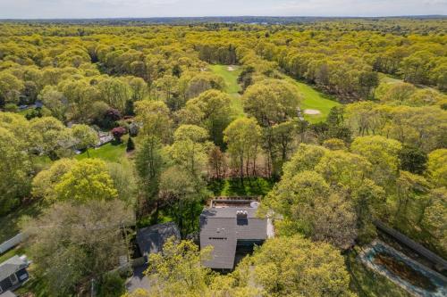 an overhead view of a house in the middle of a forest at 10 Bunker Circle Sandwich - The Clubhouse Retreat in Sandwich