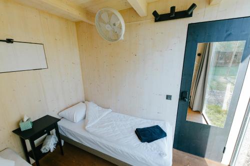 Postel nebo postele na pokoji v ubytování TRESKI Ö-majakesed