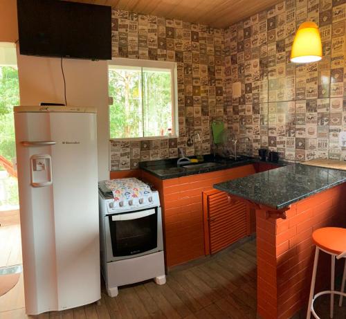 Dapur atau dapur kecil di Cabana Sítio Cachoeiras do Caledônia