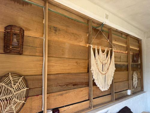 a room with a wooden wall with ropes on it at Casa Gitana in Chamuscadero