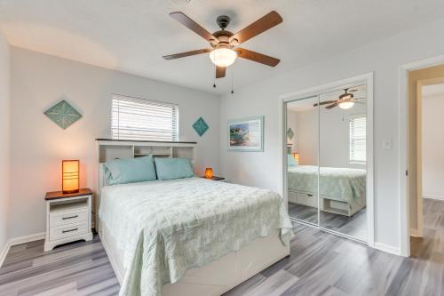 a bedroom with a bed and a ceiling fan at Swim, Golf and Relax! Kokomo on the Emerald Coast in Pensacola