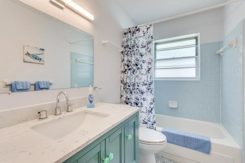 a bathroom with a sink and a toilet and a tub at Swim, Golf and Relax! Kokomo on the Emerald Coast in Pensacola