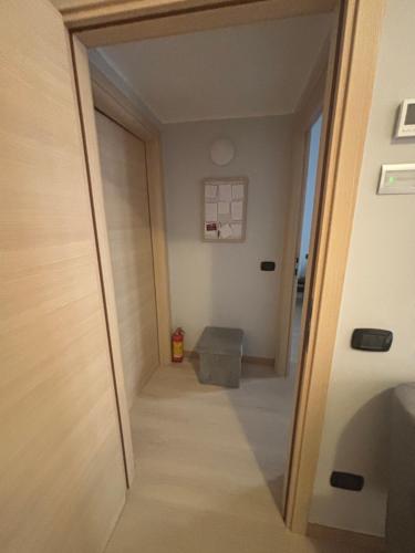 a hallway with a door leading into a room at Apartments via Roma in Rovereto