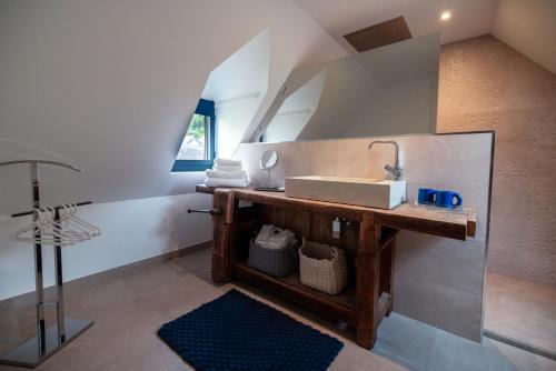 a bathroom with a sink and a mirror at La Sainthilarienne in Saint-Lary-Soulan