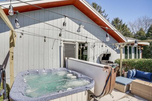 a hot tub on the back of a house at 9 Mi to Shore Home with Hot Tub in Howards Grove! in Howards Grove