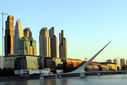 a view of a city with a bridge and buildings at Torre Le Parc - ¡Lo más exclusivo de Buenos Aires! in Buenos Aires