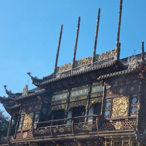 an ornate building with a blue sky in the background at Chinese Pavilion Park - Magnificent Apartment Brussels in Brussels