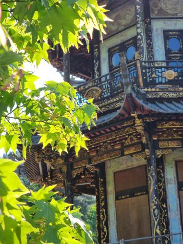 an ornate building with green leaves in front of it at Chinese Pavilion Park - Magnificent Apartment Brussels in Brussels