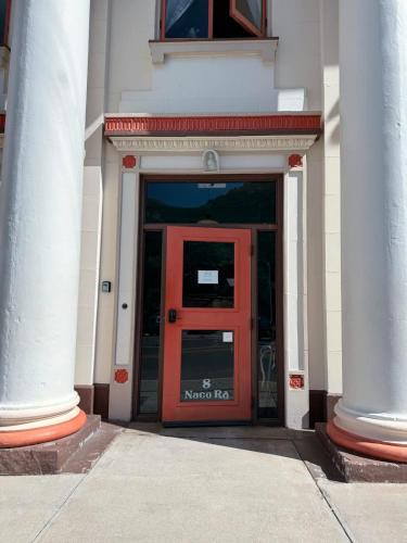 an entrance to a building with a red door at The Signature room with 2 King Beds in Bisbee