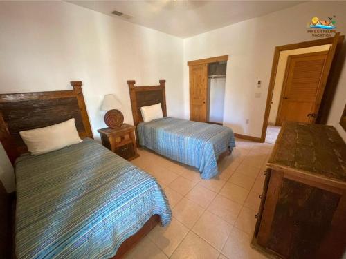 a hotel room with two beds in a room at San Felipe Luxurious 3-Bedroom Condo 11-3 with Pool Access in Playa El Paraíso
