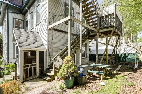 a house with a deck and a patio at Explore Dtwn, Parks and Colleges Cozy Worcester Apt in Worcester