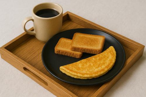 a plate with two slices of toast and a cup of coffee at North Fields Resorts in Skardu