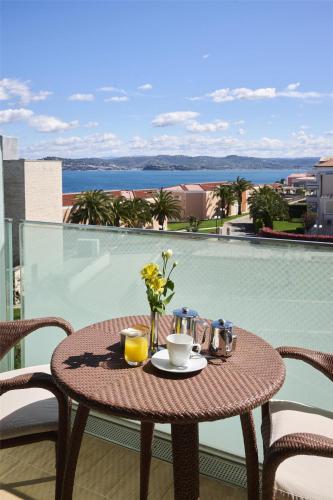 a table with a tray of breakfast food on a balcony at Kempinski Hotel Adriatic Istria Croatia in Savudrija