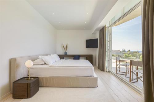 a bedroom with a bed and a balcony at Kempinski Hotel Adriatic Istria Croatia in Savudrija