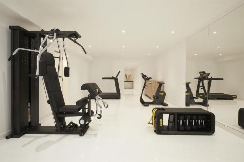 a gym with several exercise equipment in a room at Kempinski Hotel Adriatic Istria Croatia in Savudrija