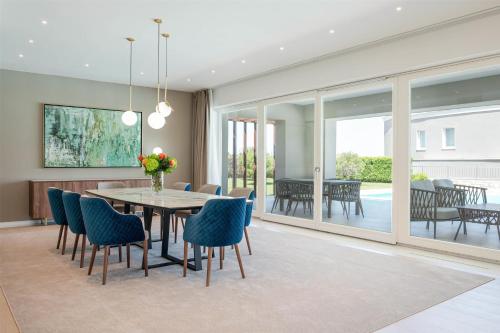 a dining room with a table and chairs at Kempinski Hotel Adriatic Istria Croatia in Savudrija