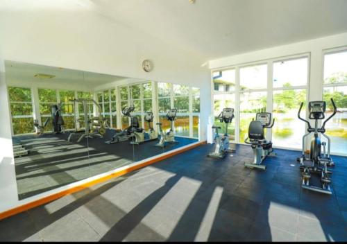 a gym with treadmills and machines in a room at Luxury fairway living-Galle apartments in Galle