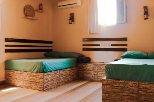 Postel nebo postele na pokoji v ubytování Tecoma guesthouse