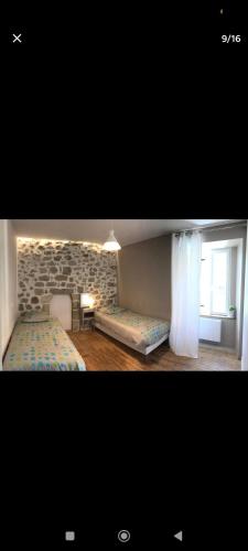 Ένα ή περισσότερα κρεβάτια σε δωμάτιο στο Maison de charme 8 personnes