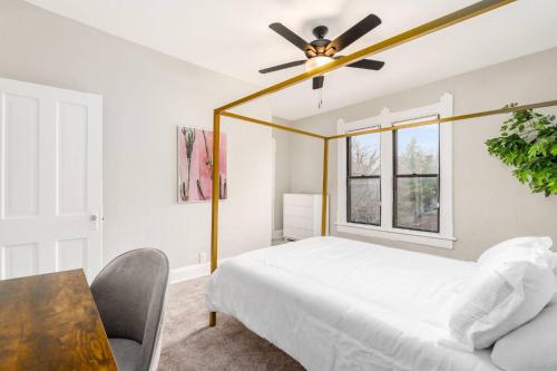 a bedroom with a bed and a ceiling fan at Short north- STEPS to High St -Private Parking-OSU in Milo