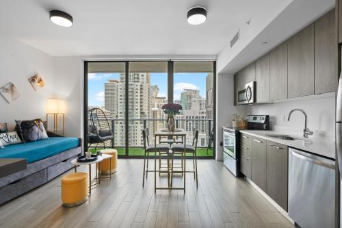 a kitchen and living room with a view of the city at Penthouse Infinity heated pool and jacuzzi in Miami