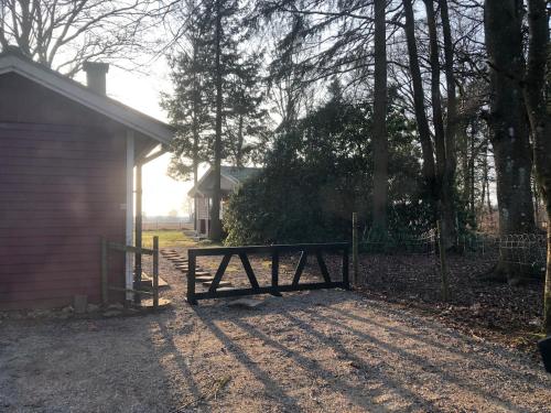 a wooden gate in front of a house at Cabin outside Sösdala in Sösdala