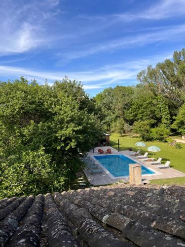 a view from the roof of a house with a swimming pool at Le Moulin de Montségur in Montségur-sur-Lauzon