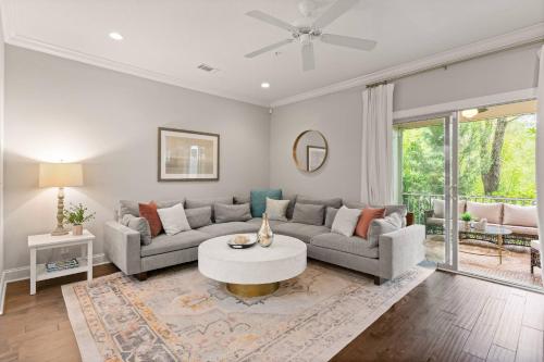 a living room with a couch and a table at Mariners Getaway in Saint Simon Mills