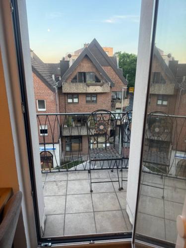 a balcony with a view of a building at Über den Dächern von Werne - Balkon, WLAN, TV und Küche - Möller in Werne an der Lippe