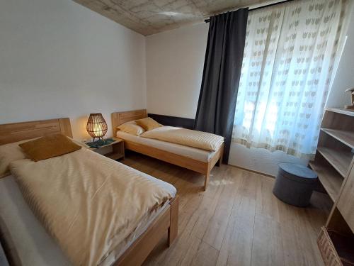 Postel nebo postele na pokoji v ubytování ZAPAČE Mýto apartmánový dom