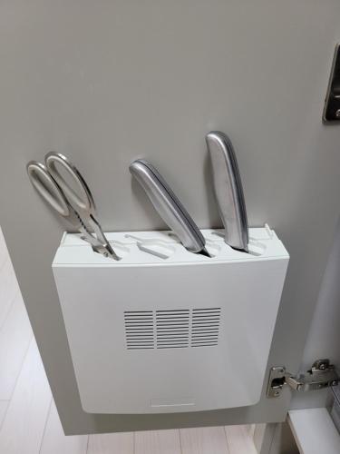 two metal faucets sitting on top of a sink at Bara H 고양 킨텍스역 종합운동장 in Goyang