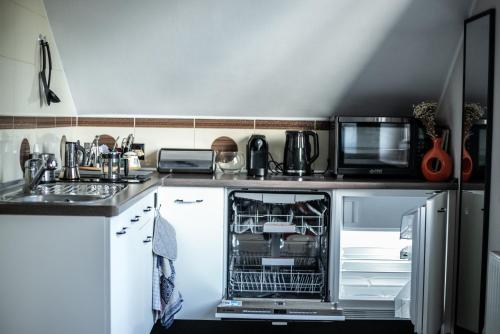 Dapur atau dapur kecil di Apartamenty u Rybaka