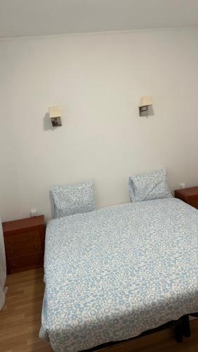 a bedroom with a bed and two pillows on it at Sweet Dreams in Albufeira