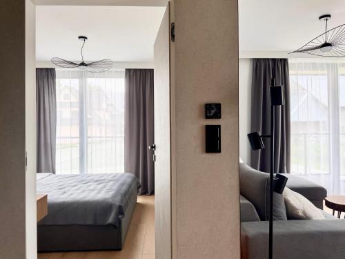 Katil atau katil-katil dalam bilik di Cyrhla Apartamenty