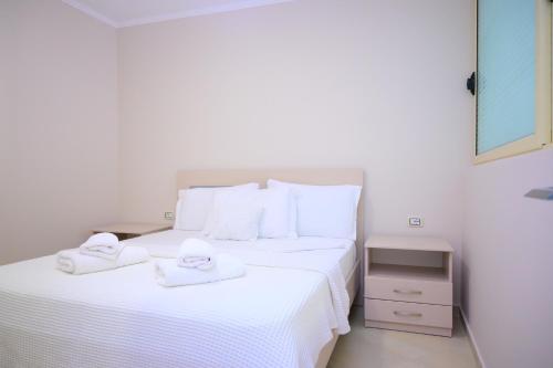 Ένα ή περισσότερα κρεβάτια σε δωμάτιο στο Eleana's Apartament