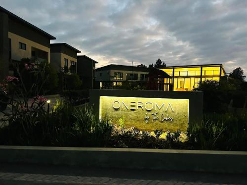 a sign that says oneonka in front of a building at One Roma by the Cubes in Lusaka