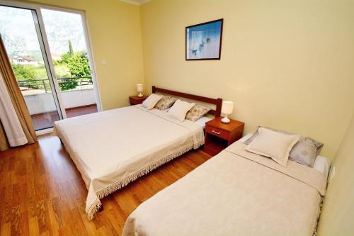 Cama o camas de una habitación en Apartments Soso