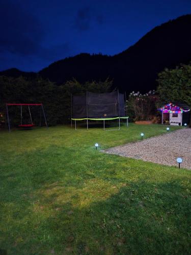 a park with a ping pong table in the grass at Kamila in Szczawnica