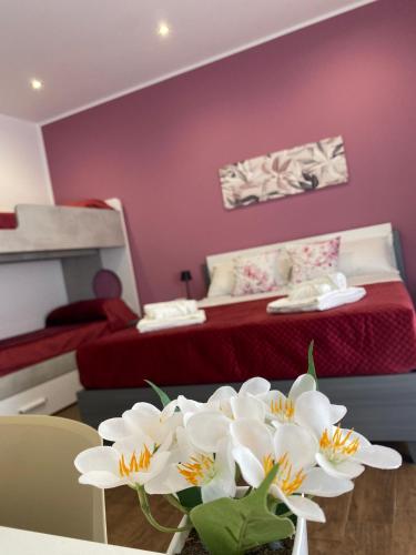 Katil atau katil-katil dalam bilik di Palermo Flowers Suites