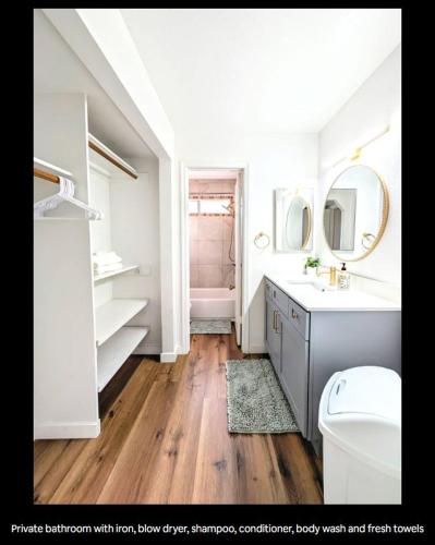 a bathroom with a sink and a toilet and a mirror at Cactus Guest Suite in Chandler