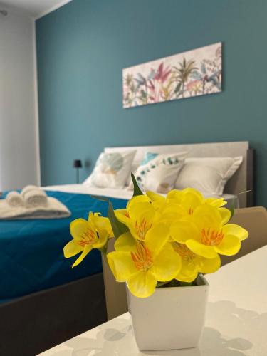 Katil atau katil-katil dalam bilik di Palermo Flowers Suites