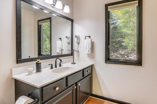 a bathroom with a sink and a mirror at 4 Mi to Massanutten Resort Family Home with Views! in McGaheysville