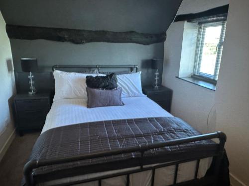 a bedroom with a bed with a teddy bear on it at Norwood House in Newport