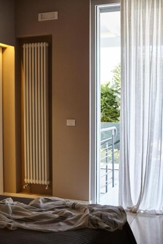 Katil atau katil-katil dalam bilik di Villa Dapper Apartment 3
