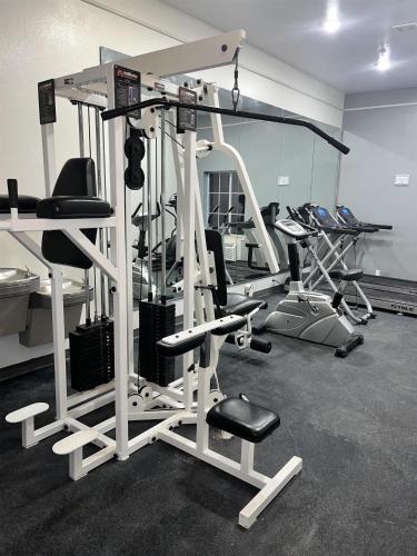 a gym with several exercise equipment in a room at Sonesta Essential North Houston in Houston