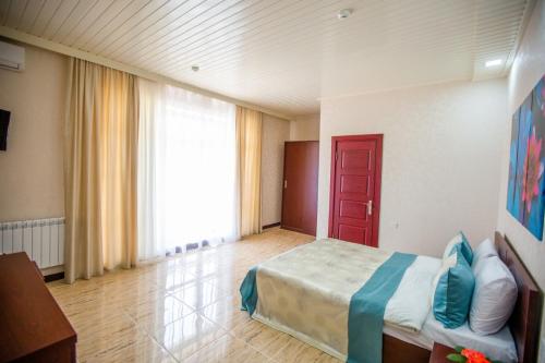 Ένα ή περισσότερα κρεβάτια σε δωμάτιο στο Bliss Inn Hotel Gabala Vandam